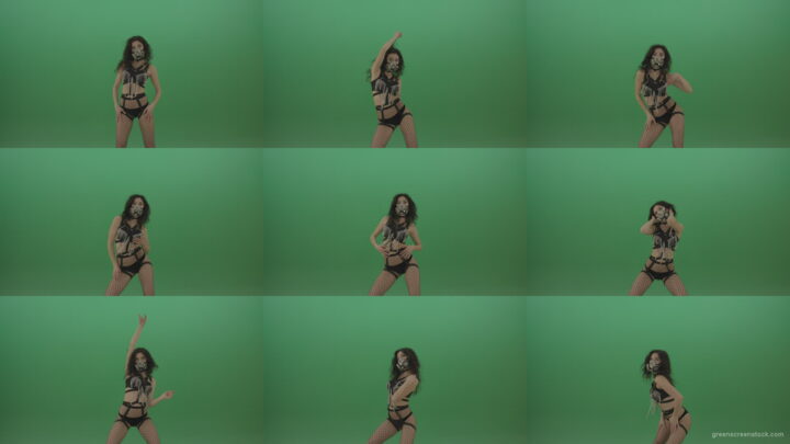 Girl-in-black-suit-and-suit-erotic-dance-on-green-background Green Screen Stock
