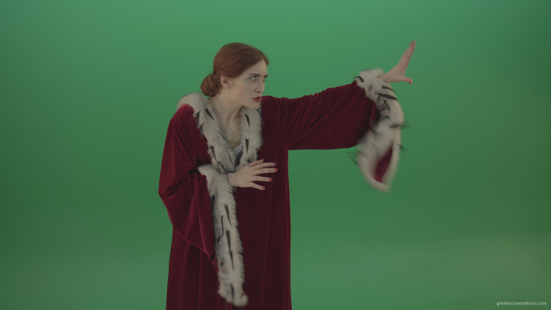 Girl-is-dressed-in-a-red-cloak-shoots-proton-lasers-_002 Green Screen Stock