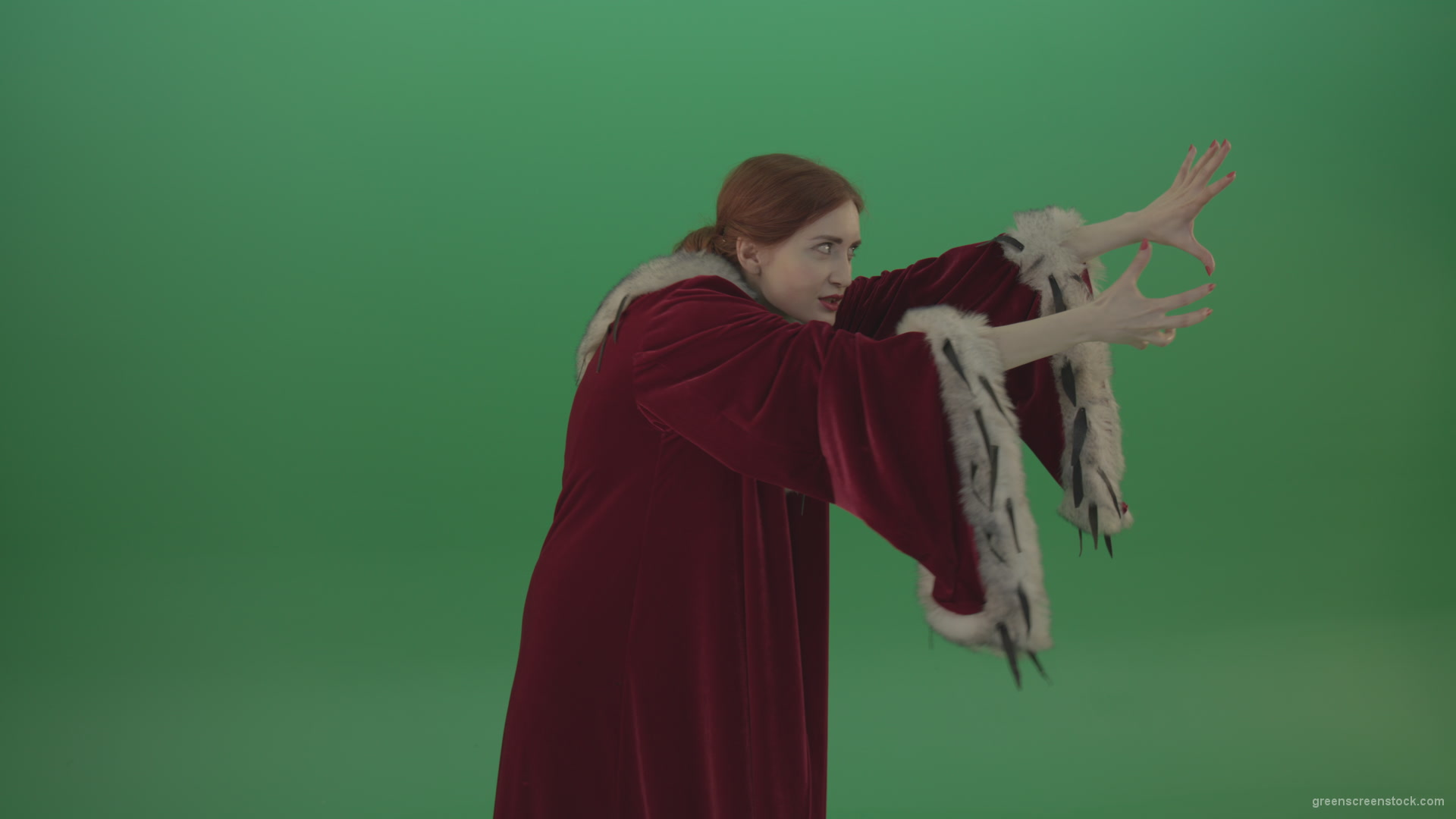 Girl-is-dressed-in-a-red-cloak-shoots-proton-lasers-_005 Green Screen Stock