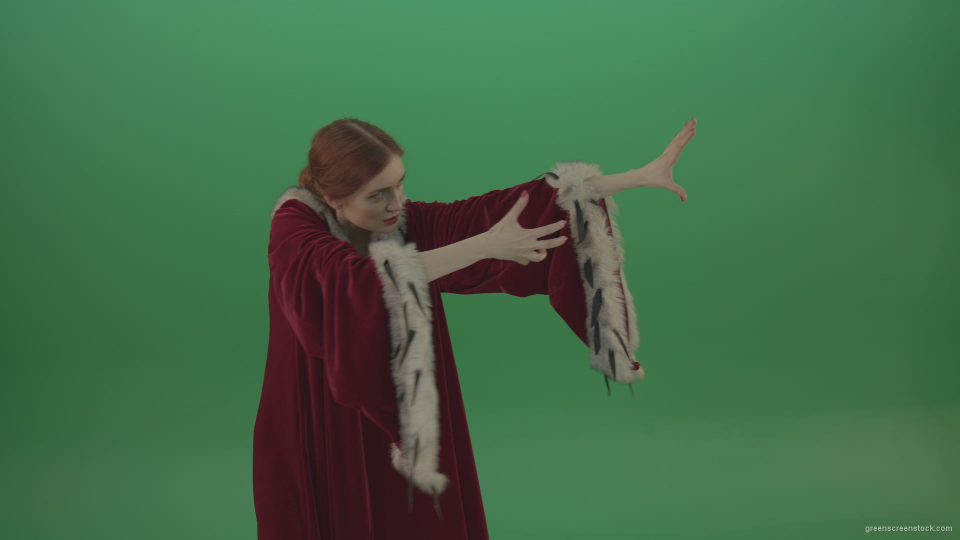 Girl-is-dressed-in-a-red-cloak-shoots-proton-lasers-_006 Green Screen Stock