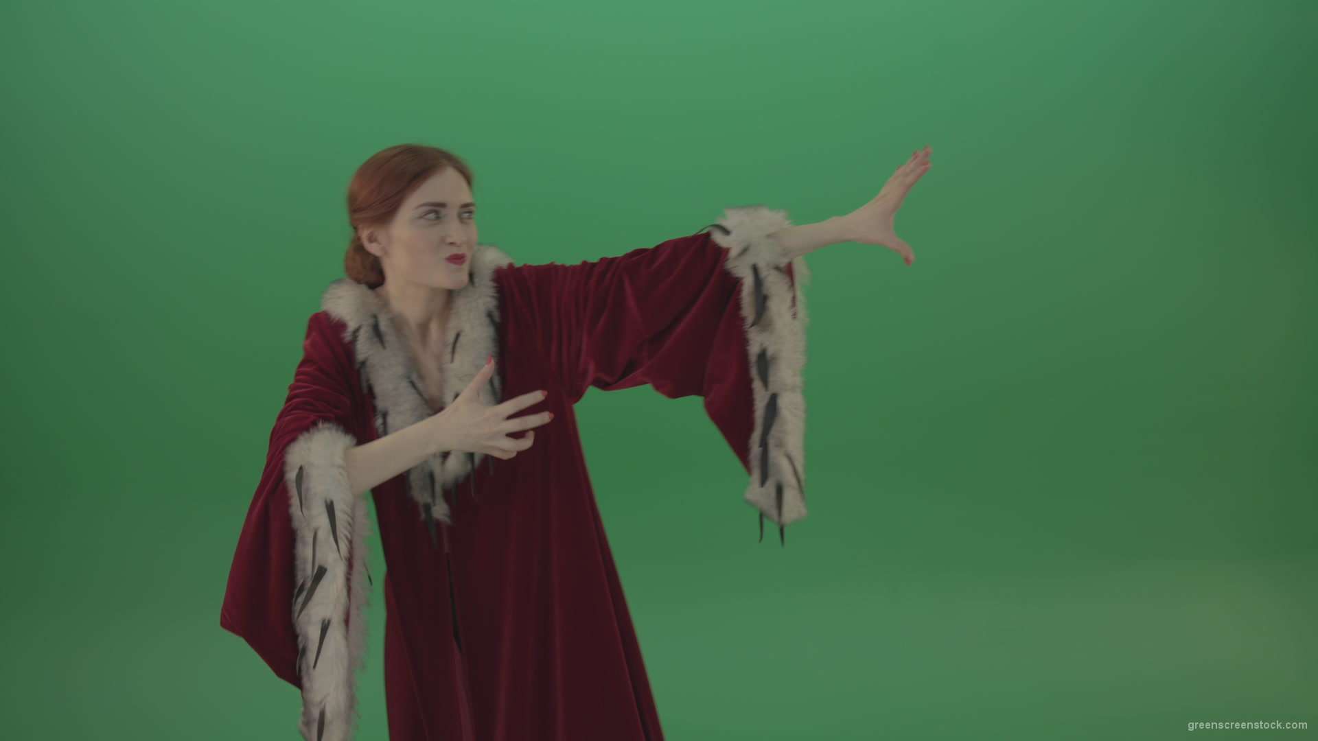 Girl-is-dressed-in-a-red-cloak-shoots-proton-lasers-_007 Green Screen Stock