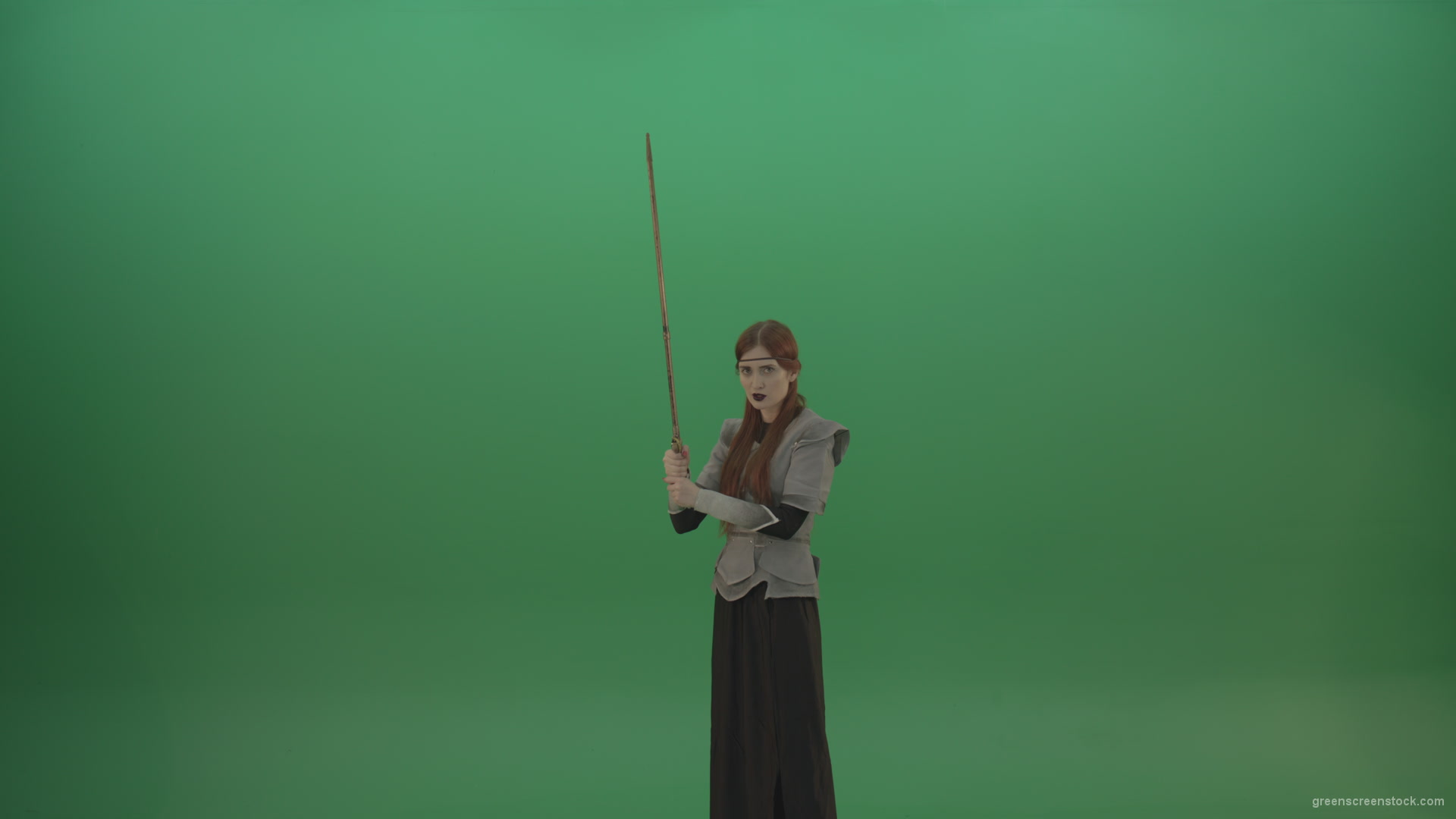 Girl-shouts-her-foes-on-an-offensive-raising-a-sword-up-on-a-green-background_002 Green Screen Stock