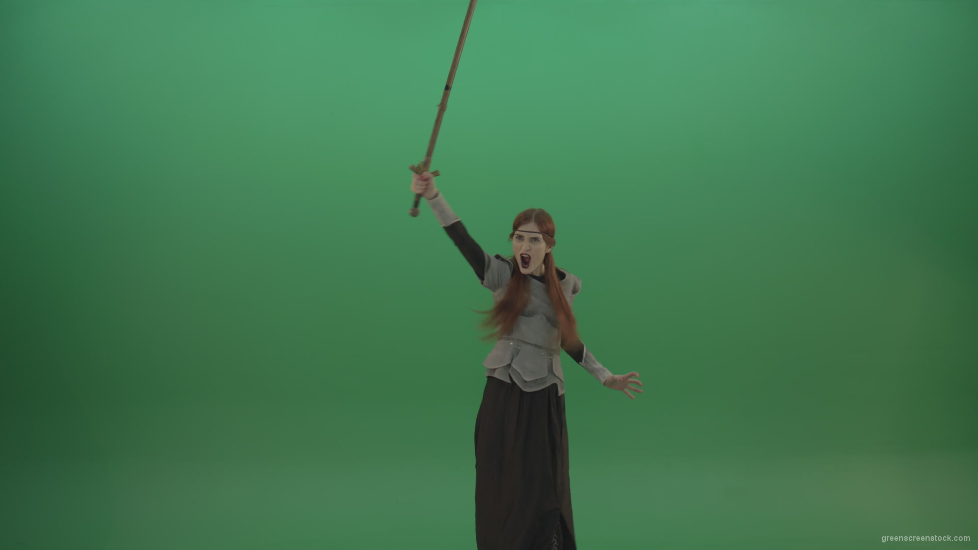 Girl-shouts-her-foes-on-an-offensive-raising-a-sword-up-on-a-green-background_005 Green Screen Stock