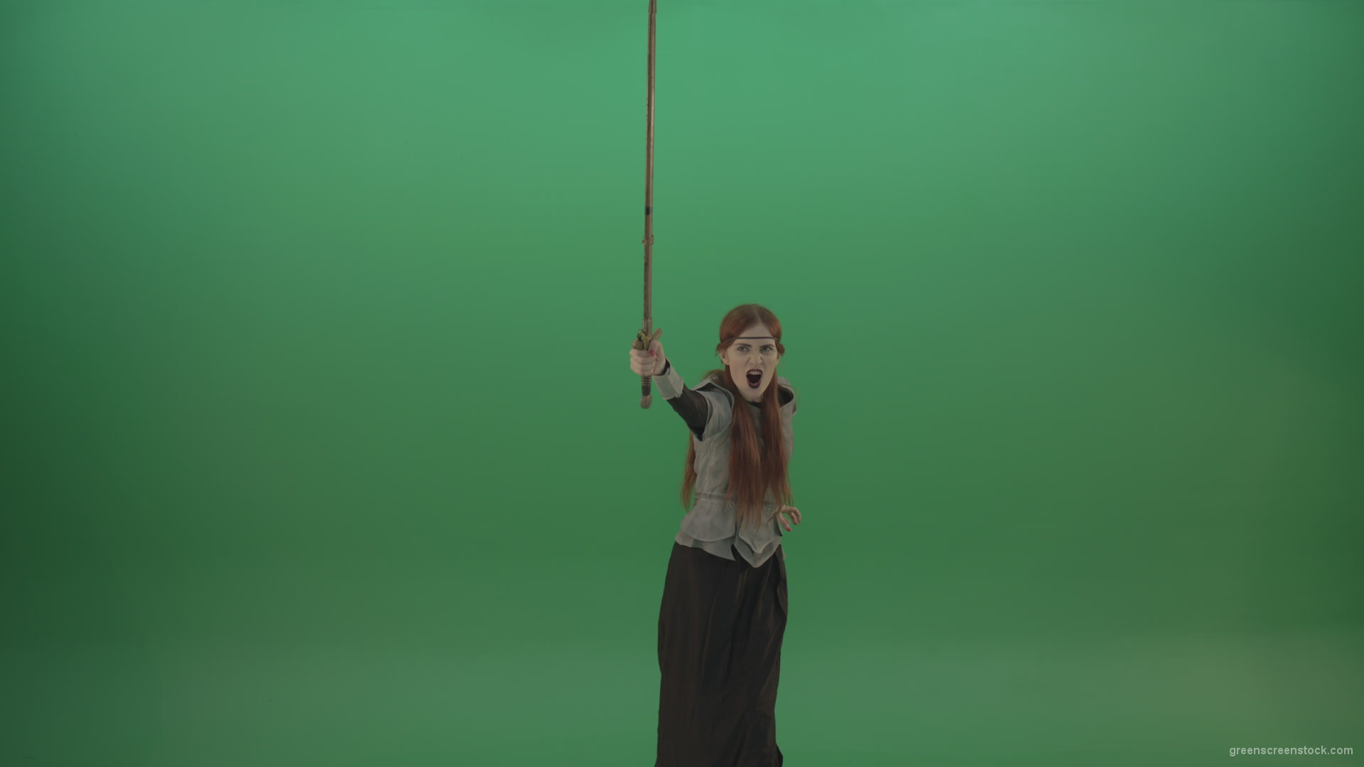 Girl-shouts-her-foes-on-an-offensive-raising-a-sword-up-on-a-green-background_007 Green Screen Stock