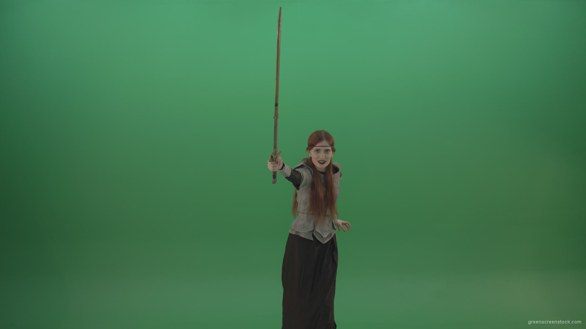 Girl-shouts-her-foes-on-an-offensive-raising-a-sword-up-on-a-green-background_008 Green Screen Stock