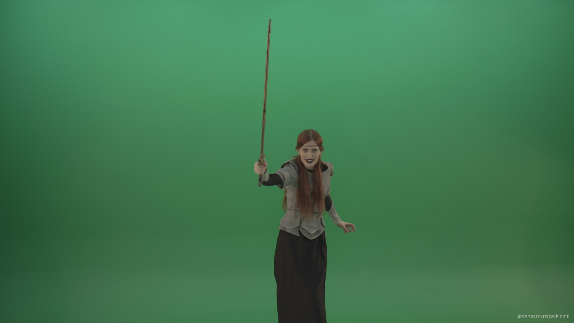 Girl-shouts-her-foes-on-an-offensive-raising-a-sword-up-on-a-green-background_009 Green Screen Stock