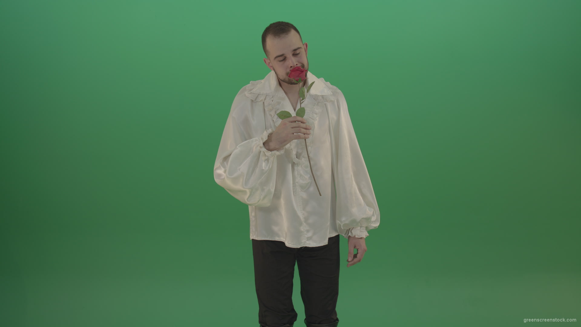 Glancing-at-the-red-flower-the-guy-gives-love-rose-to-camera-isolated-on-green-screen_004 Green Screen Stock
