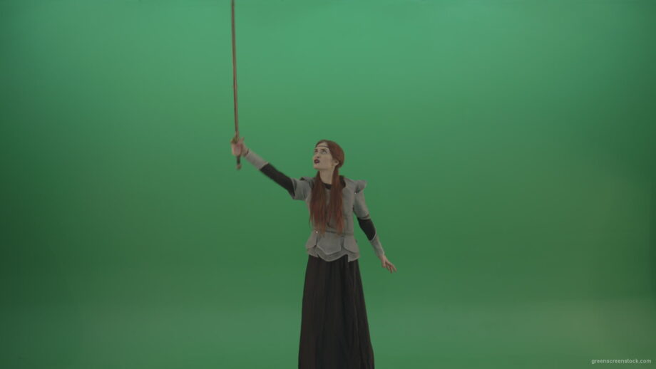 vj video background Great-sword-in-the-hands-of-a-mighty-warrior-girl-lifted-up-one-hand-on-a-green-background_003