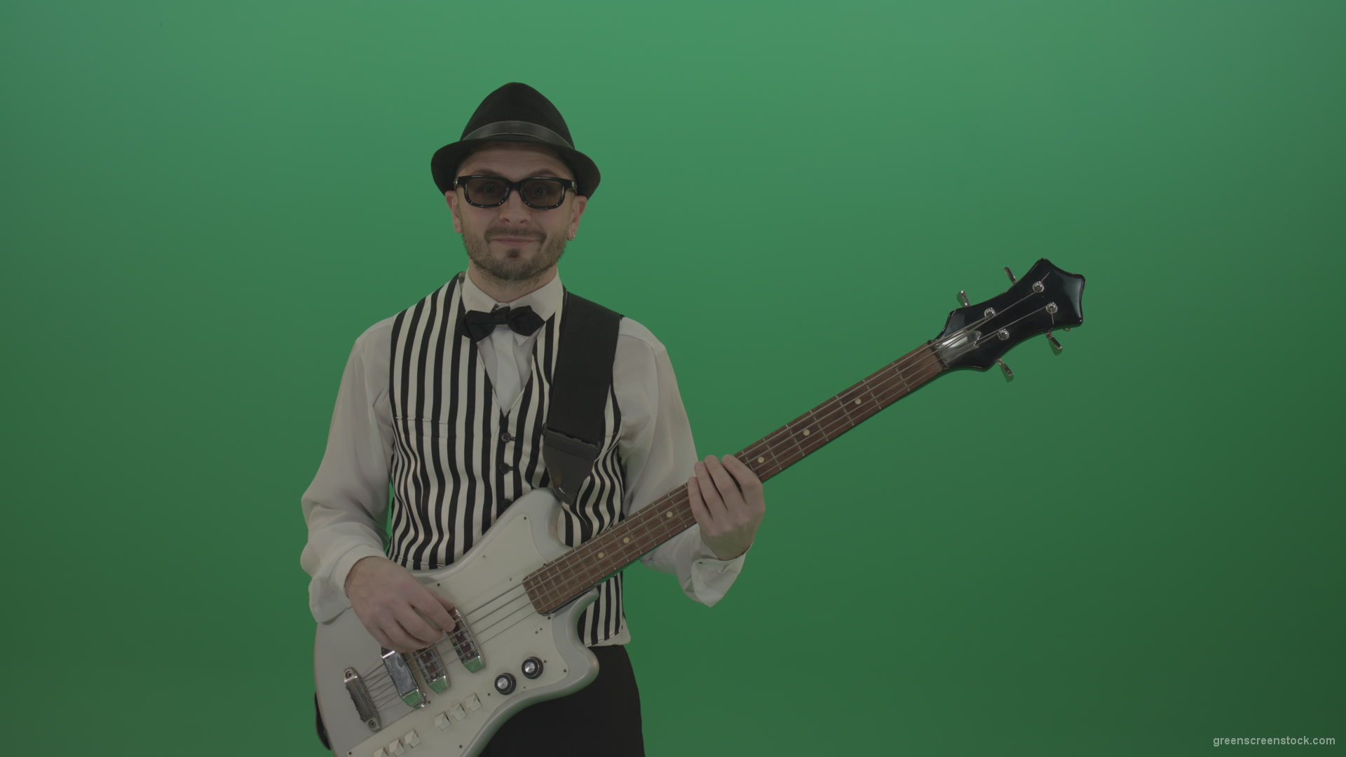 Guitar-player-browses-the-bass-guitar-playing-solo-and-charismatically-shows-facial-expressions_001 Green Screen Stock