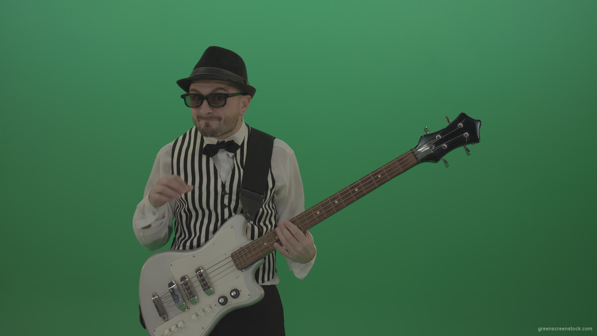 Guitar-player-browses-the-bass-guitar-playing-solo-and-charismatically-shows-facial-expressions_002 Green Screen Stock