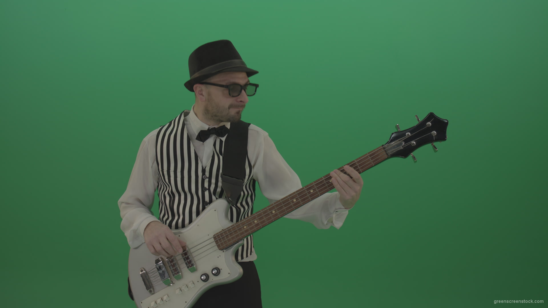 Guitar-player-browses-the-bass-guitar-playing-solo-and-charismatically-shows-facial-expressions_004 Green Screen Stock