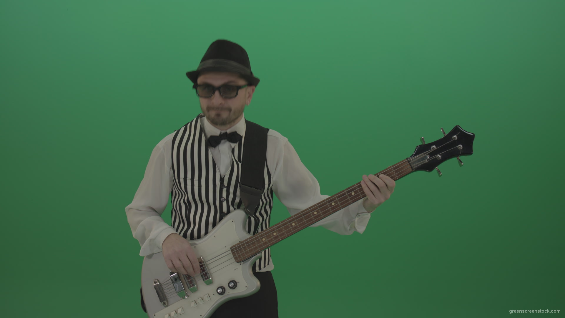 Guitar-player-browses-the-bass-guitar-playing-solo-and-charismatically-shows-facial-expressions_005 Green Screen Stock