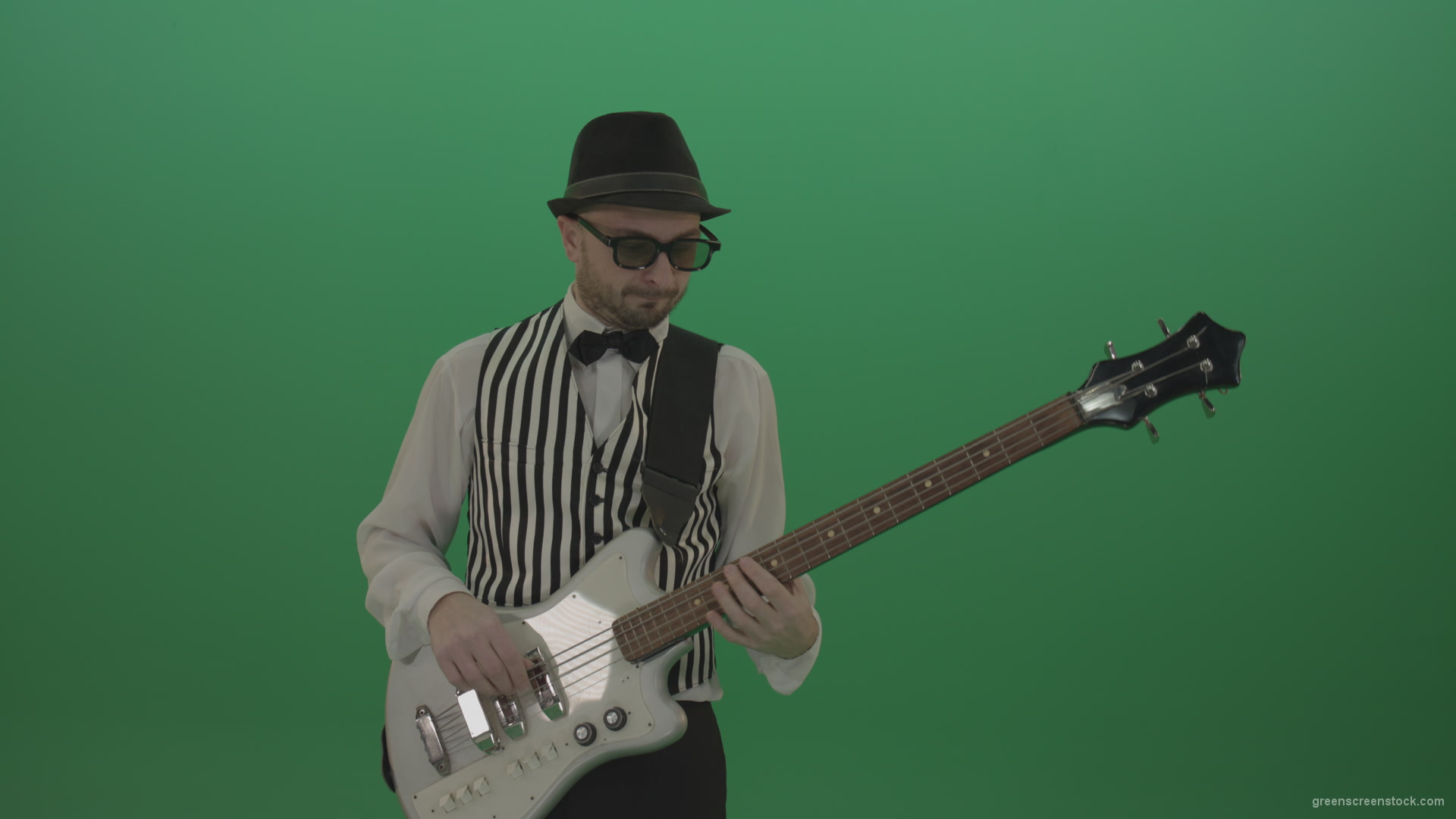 Guitar-player-browses-the-bass-guitar-playing-solo-and-charismatically-shows-facial-expressions_007 Green Screen Stock