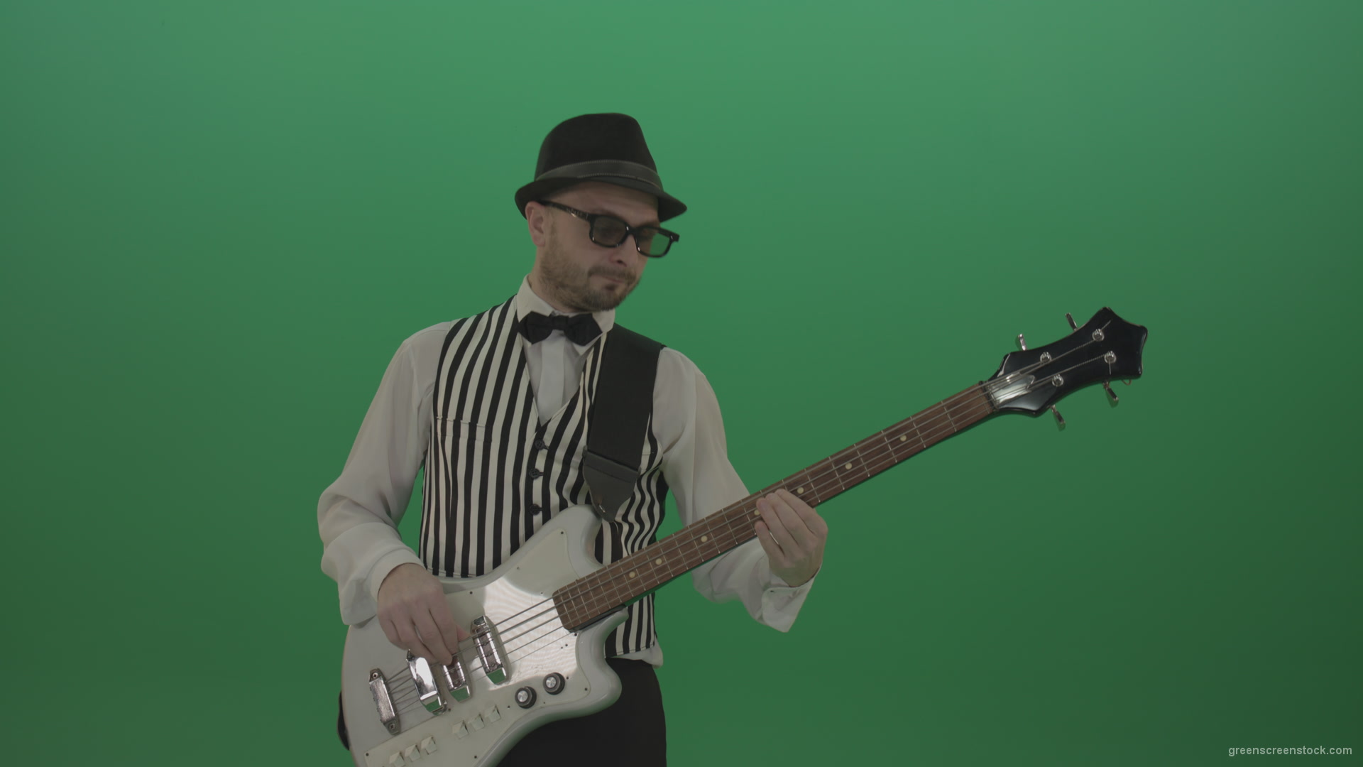 Guitar-player-browses-the-bass-guitar-playing-solo-and-charismatically-shows-facial-expressions_008 Green Screen Stock