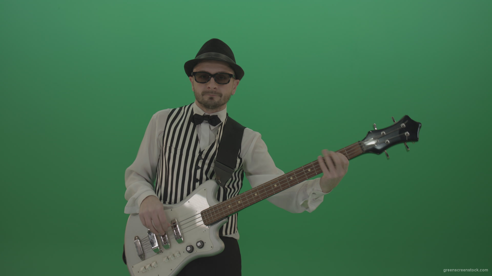 Guitar-player-browses-the-bass-guitar-playing-solo-and-charismatically-shows-facial-expressions_009 Green Screen Stock