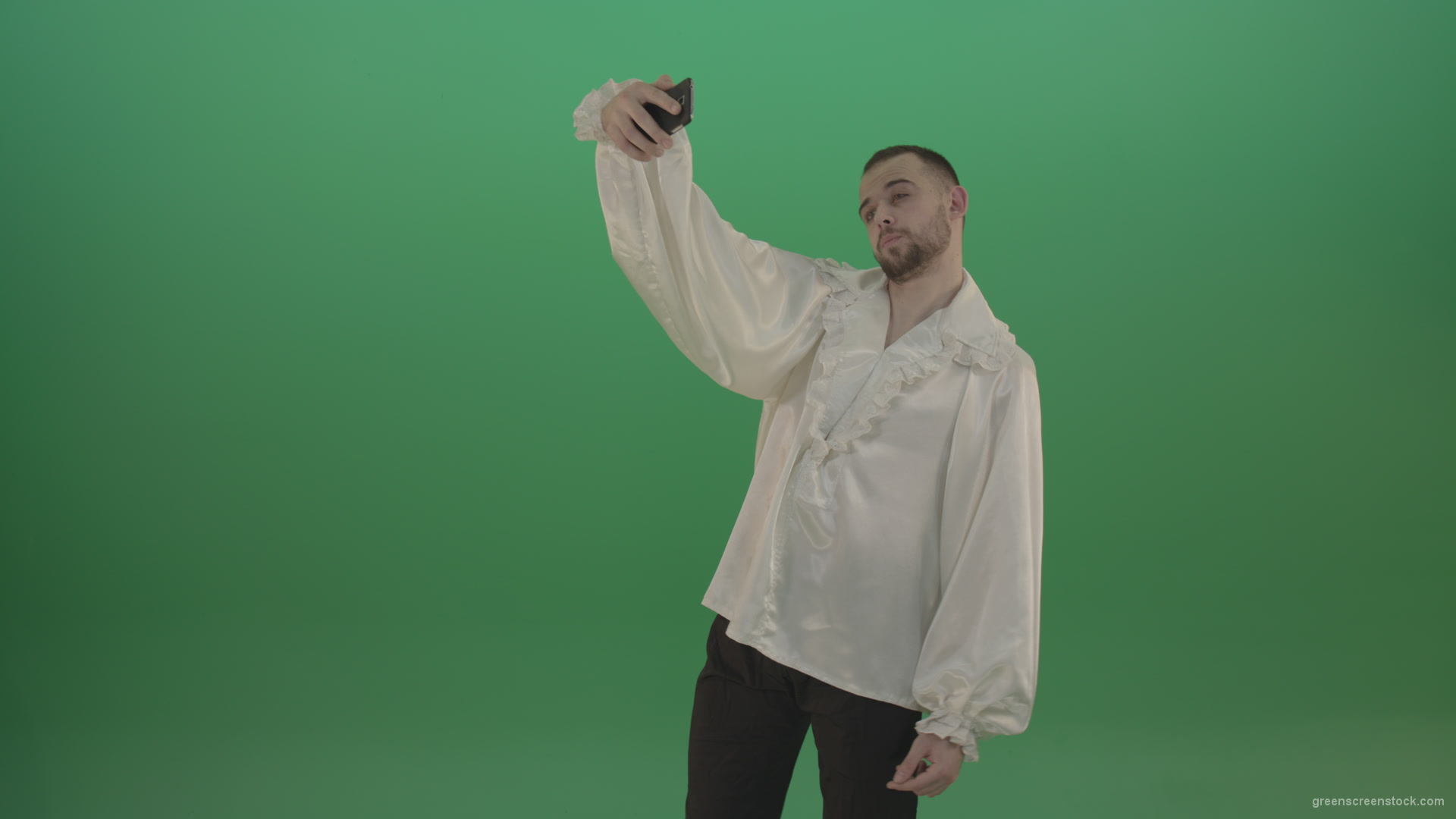 Guy-makes-a-selphi-and-posing-to-the-camera-isolated-on-green-screen_005 Green Screen Stock