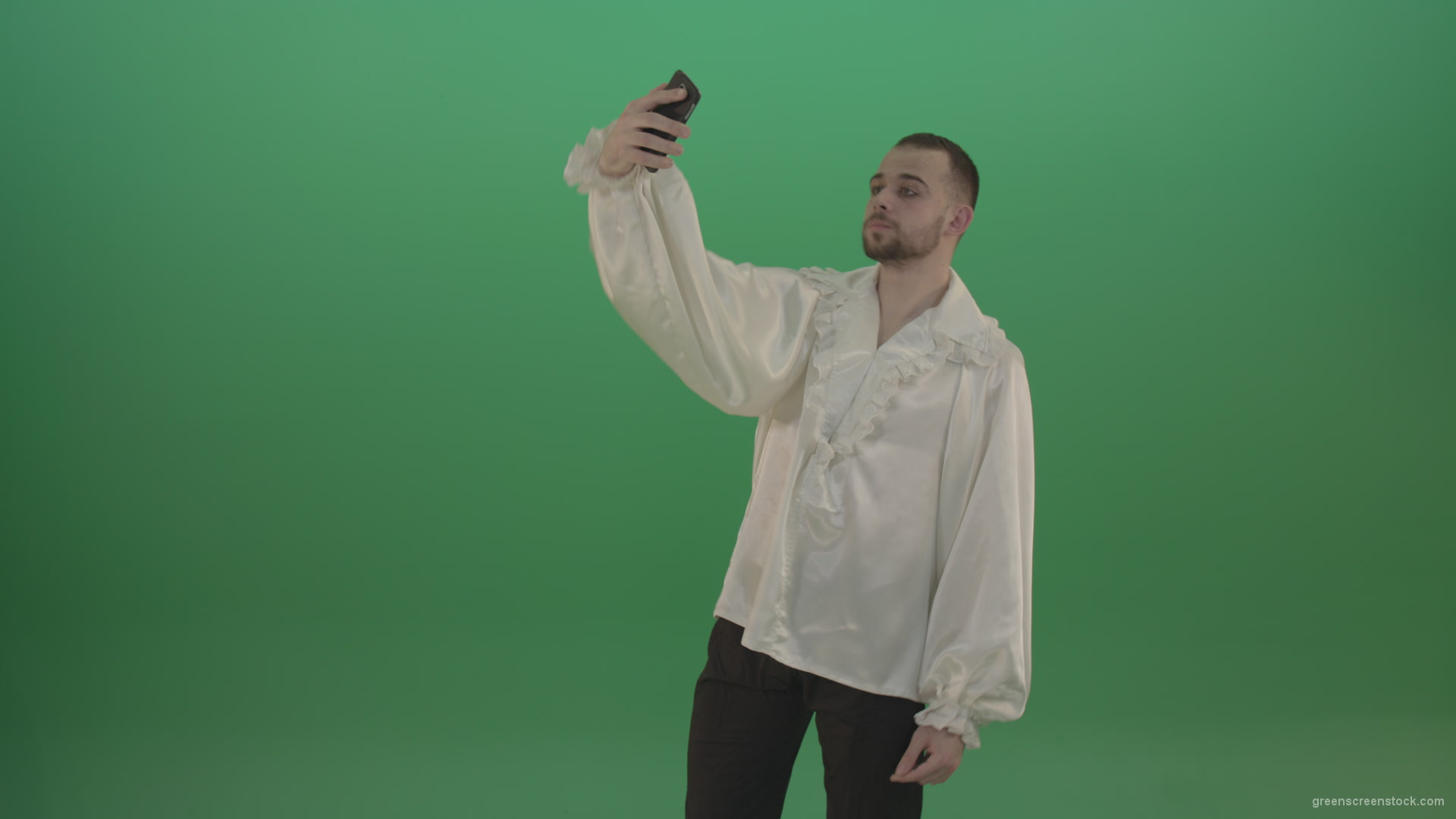 Guy-makes-a-selphi-and-posing-to-the-camera-isolated-on-green-screen_006 Green Screen Stock