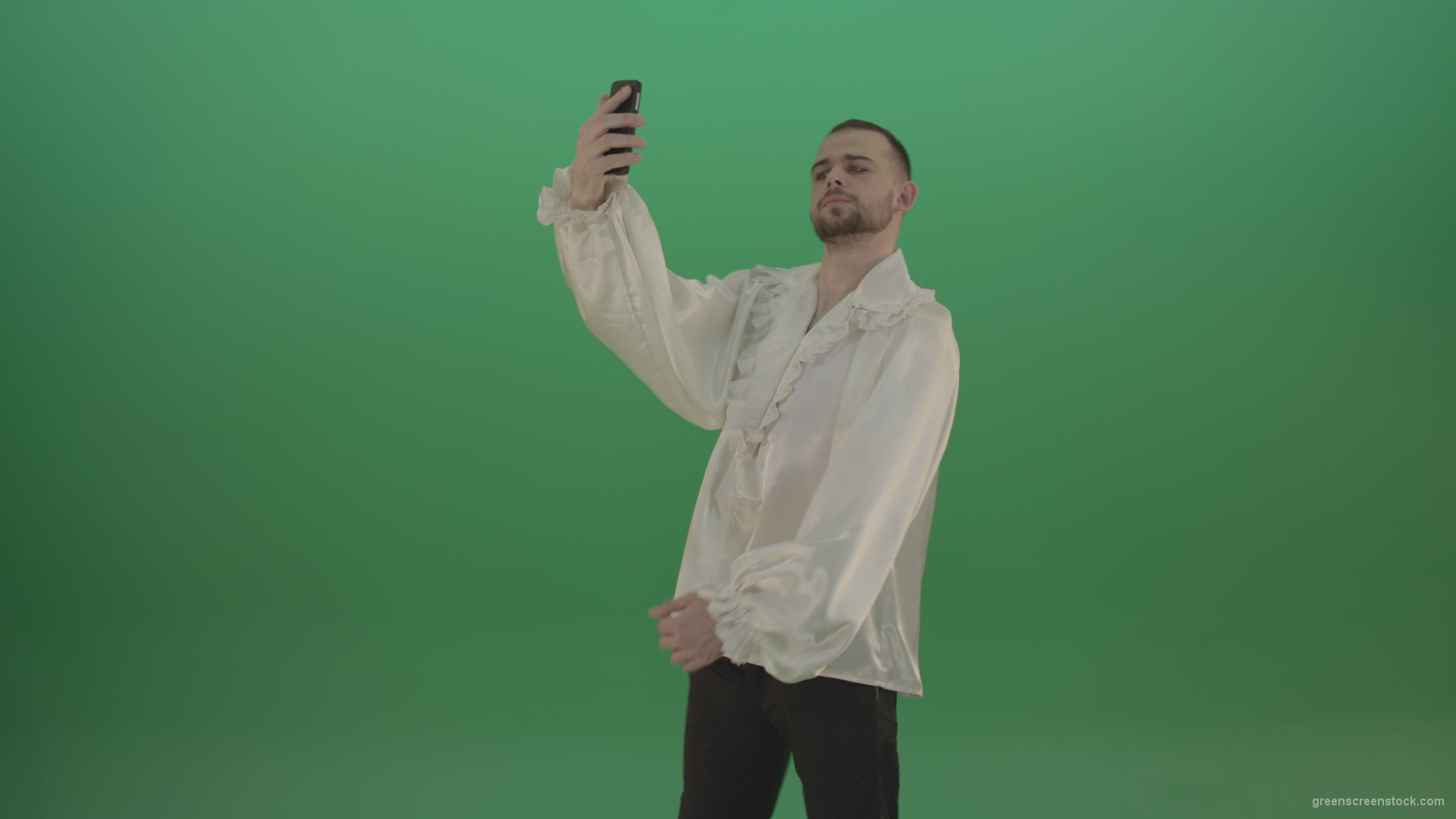 Guy-makes-a-selphi-and-posing-to-the-camera-isolated-on-green-screen_007 Green Screen Stock