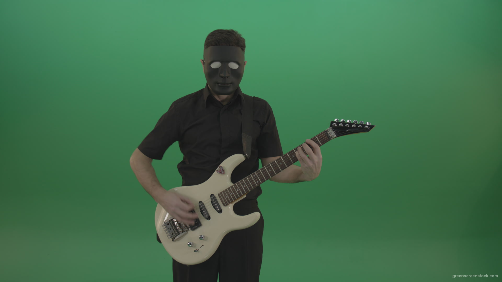 Hard-rock-guitarist-man-playing-white-guitar-in-black-mask-isolated-on-green-background_004 Green Screen Stock