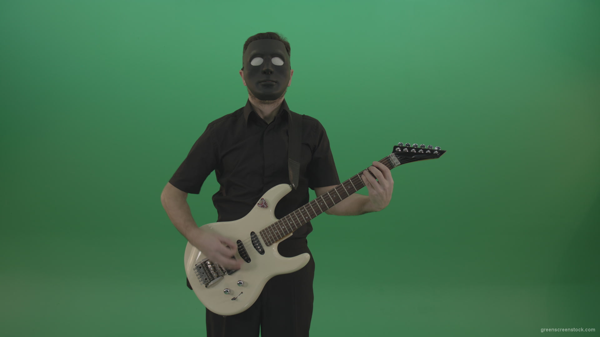 Hard-rock-guitarist-man-playing-white-guitar-in-black-mask-isolated-on-green-background_005 Green Screen Stock
