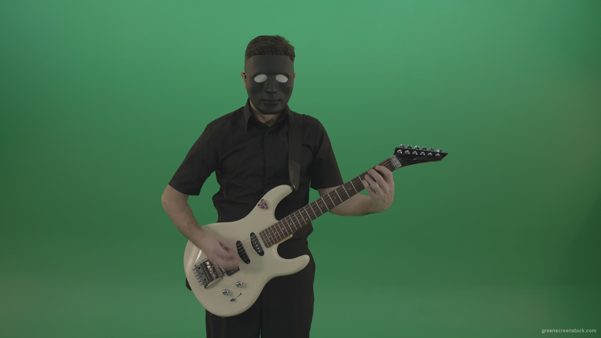 Hard-rock-guitarist-man-playing-white-guitar-in-black-mask-isolated-on-green-background_006 Green Screen Stock
