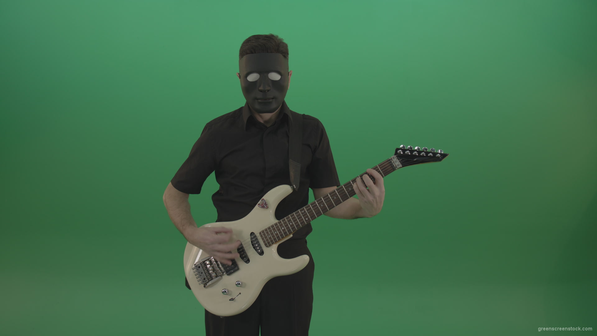 Hard-rock-guitarist-man-playing-white-guitar-in-black-mask-isolated-on-green-background_008 Green Screen Stock