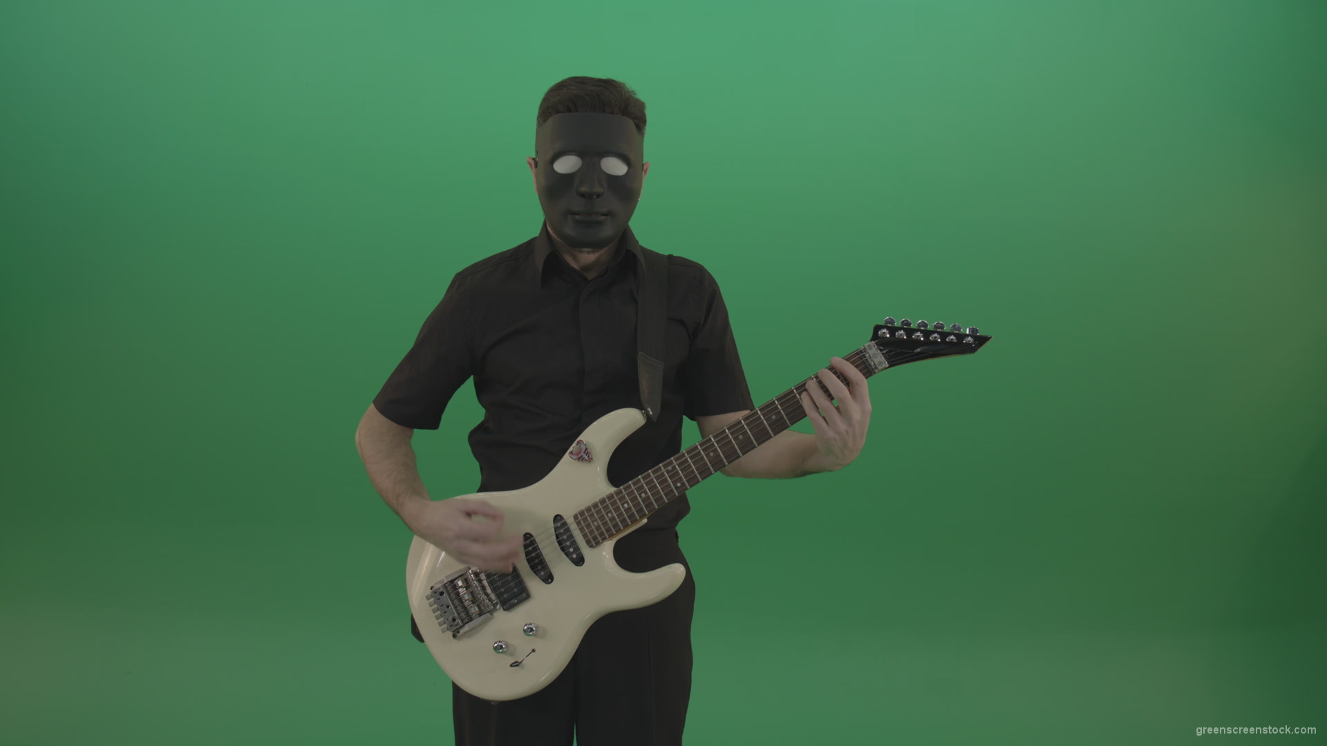 Hard-rock-guitarist-man-playing-white-guitar-in-black-mask-isolated-on-green-background_009 Green Screen Stock