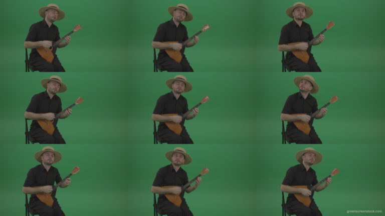 Man-from-village-play-Balalaika-music-instrument-isolated-on-green-screen Green Screen Stock