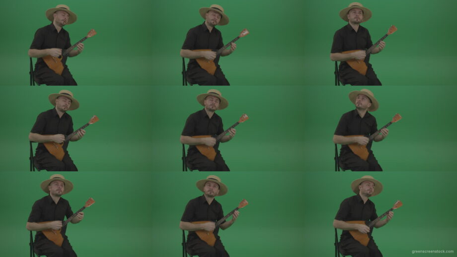 Man-from-village-play-Balalaika-music-instrument-isolated-on-green-screen Green Screen Stock