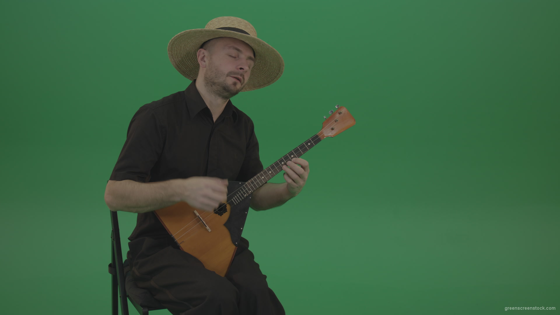 Man-from-village-play-Balalaika-music-instrument-isolated-on-green-screen_001 Green Screen Stock
