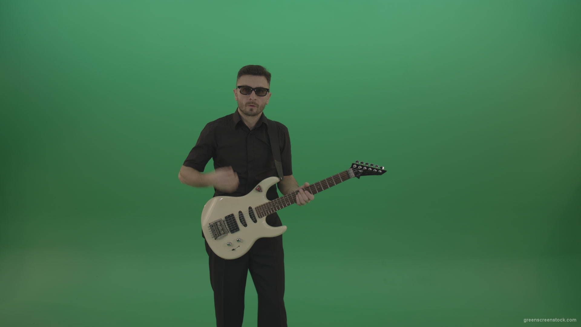 Man-in-black-costume-virtuoso-play-white-electro-rythm-guitar-isolated-on-green-screen_001 Green Screen Stock