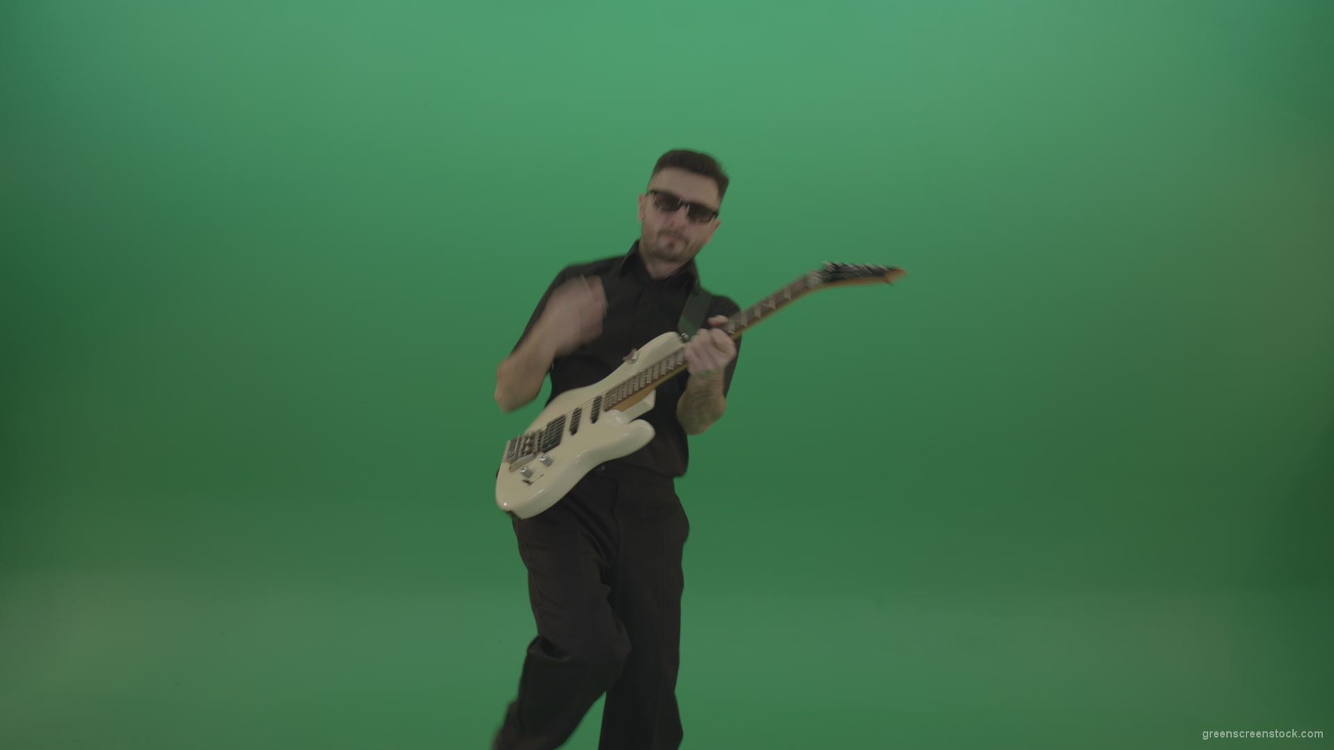 Man-in-black-costume-virtuoso-play-white-electro-rythm-guitar-isolated-on-green-screen_002 Green Screen Stock