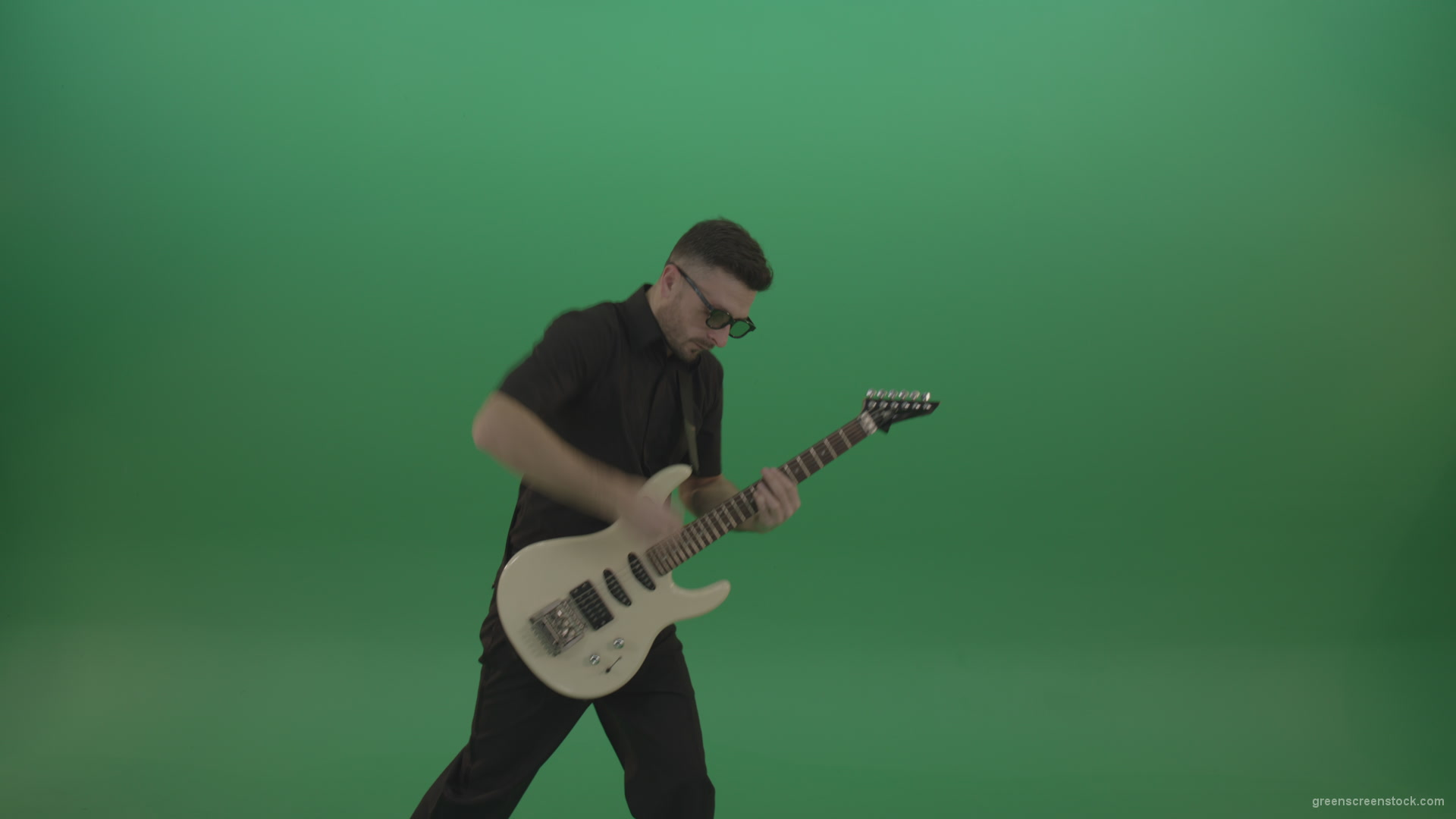 Man-in-black-costume-virtuoso-play-white-electro-rythm-guitar-isolated-on-green-screen_004 Green Screen Stock
