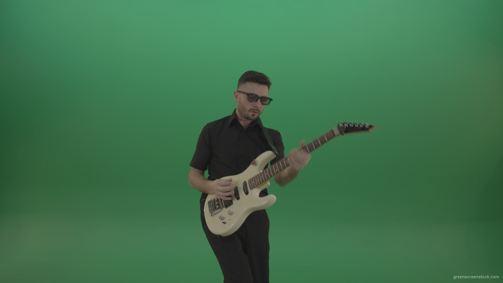 Man-in-black-costume-virtuoso-play-white-electro-rythm-guitar-isolated-on-green-screen_007 Green Screen Stock