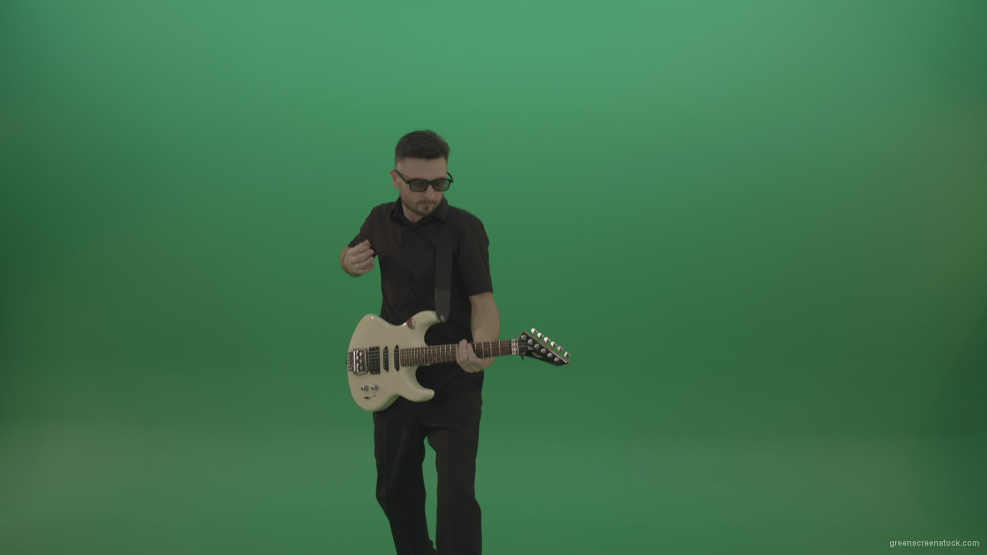 Man-in-black-costume-virtuoso-play-white-electro-rythm-guitar-isolated-on-green-screen_009 Green Screen Stock
