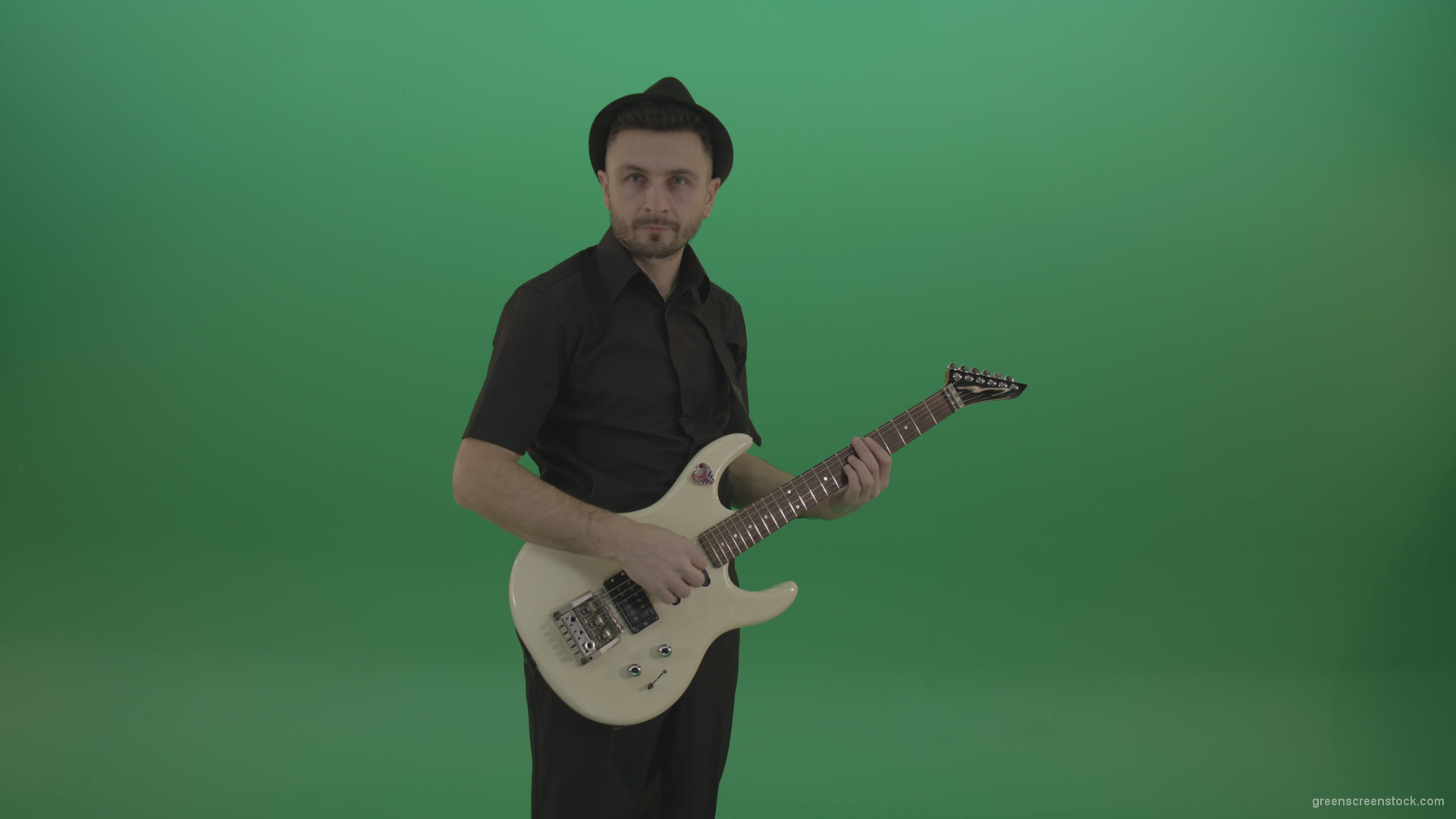 Man-in-black-playing-white-guitar-on-green-screen_001 Green Screen Stock