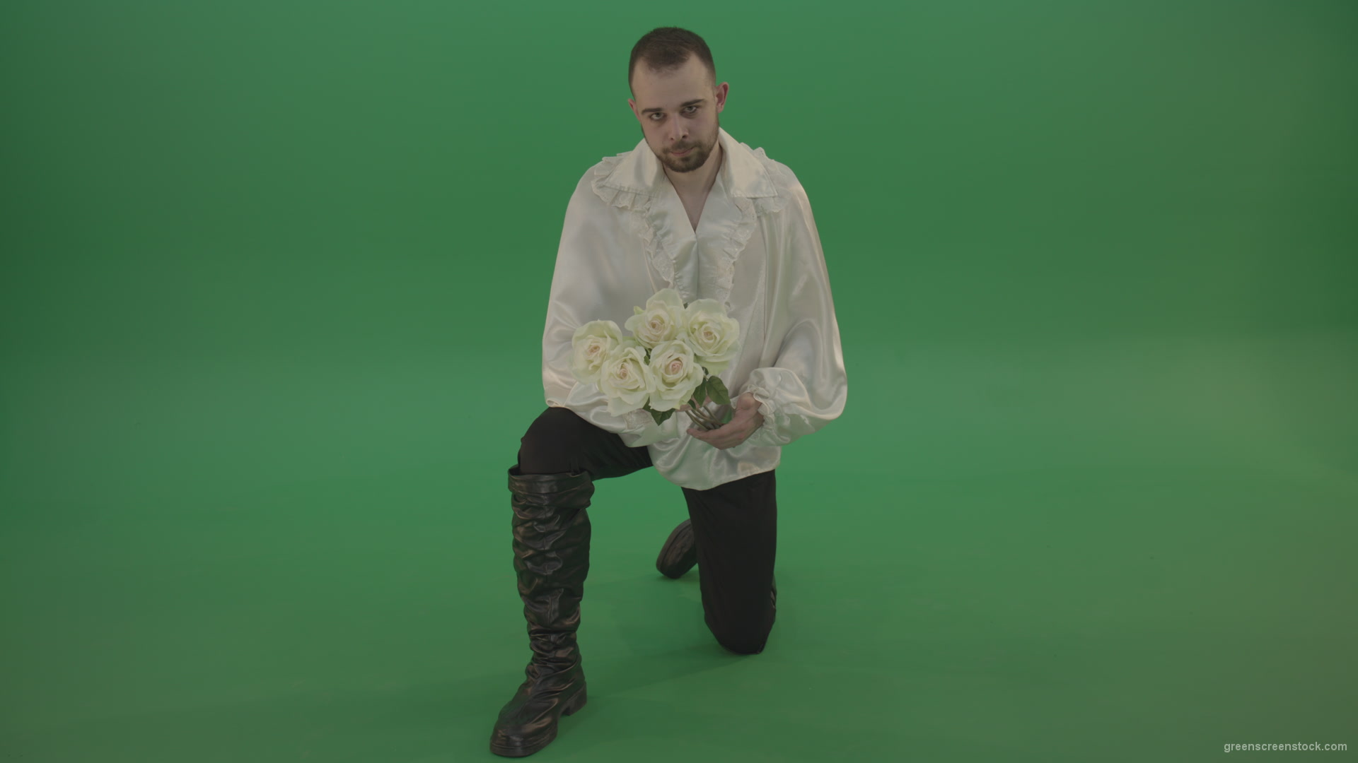 Medieval-man-gives-white-flowers-standing-on-one-knee-isolated-in-green-screen-studio_002 Green Screen Stock