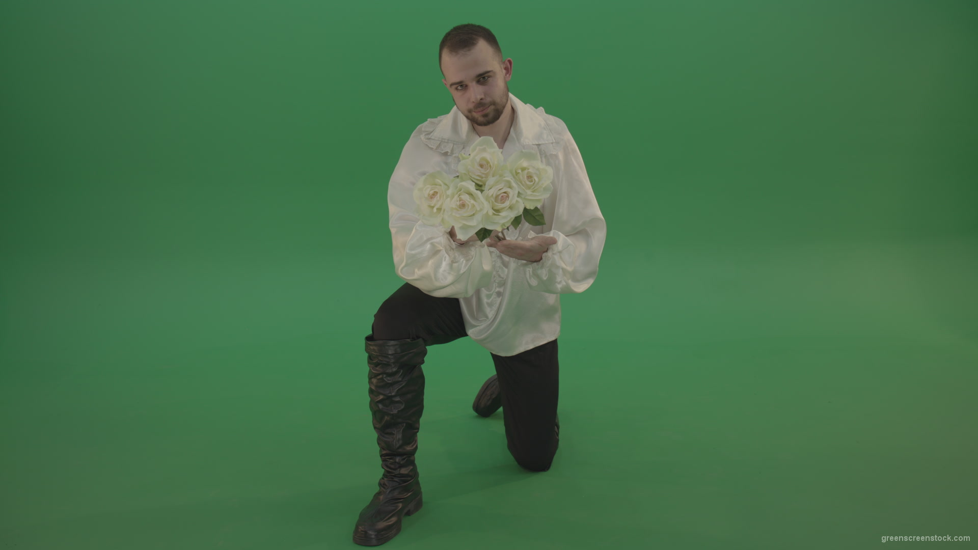 Medieval-man-gives-white-flowers-standing-on-one-knee-isolated-in-green-screen-studio_005 Green Screen Stock