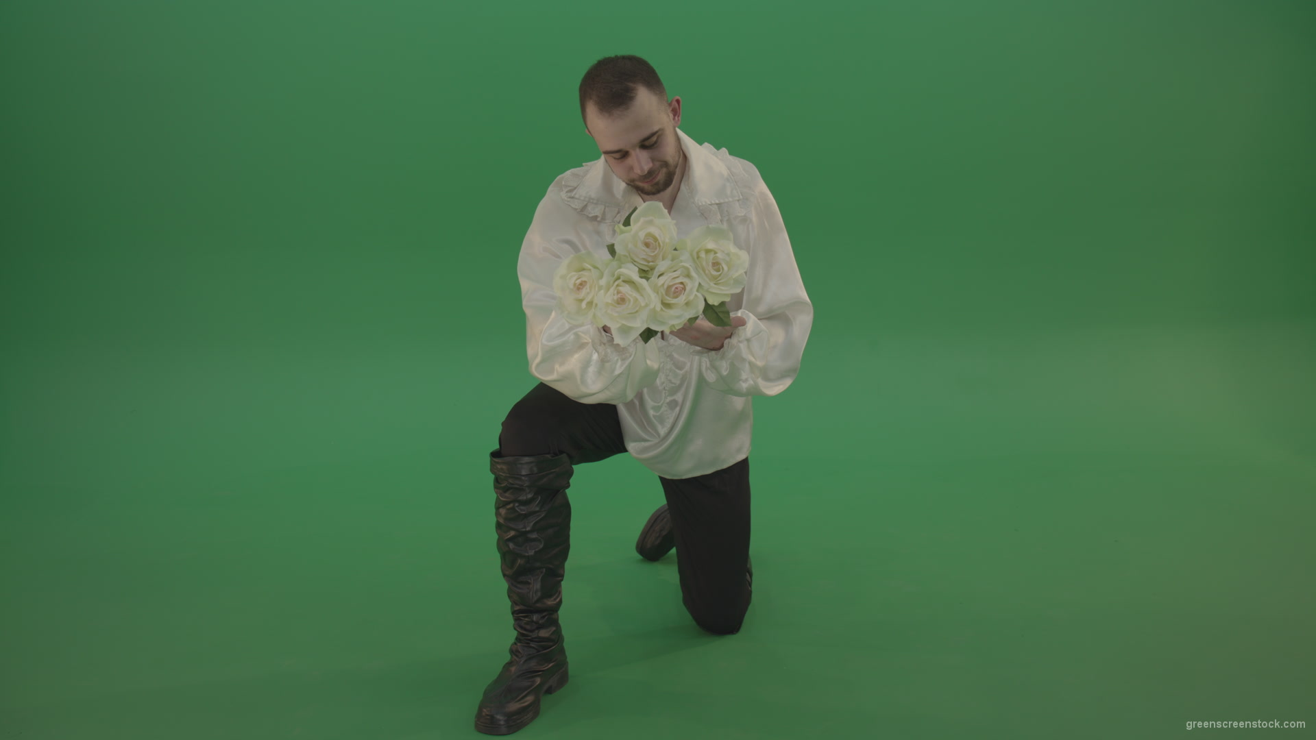 Medieval-man-gives-white-flowers-standing-on-one-knee-isolated-in-green-screen-studio_008 Green Screen Stock