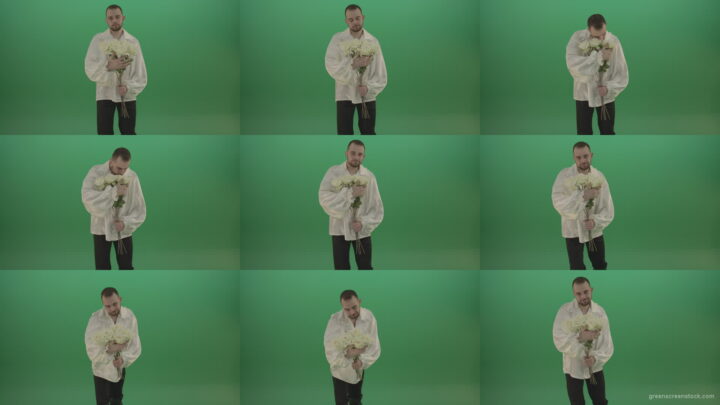Middle-Age-theater-actor-boy-give-to-camera-White-flowers-isolated-on-green-background Green Screen Stock
