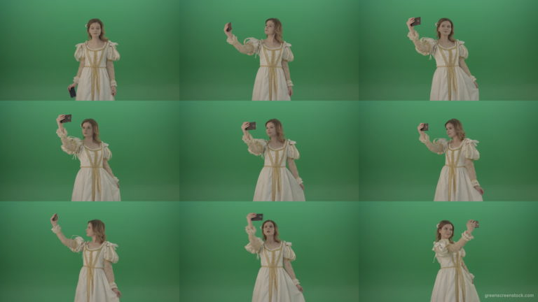 Princess-girl-dressed-in-a-light-suit-makes-a-sephi-on-a-modern-phone-isolated-on-chromakey-background Green Screen Stock