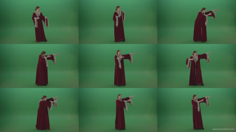 Red-dress-Witch-shooting-black-magic-energy-on-a-green-background Green Screen Stock