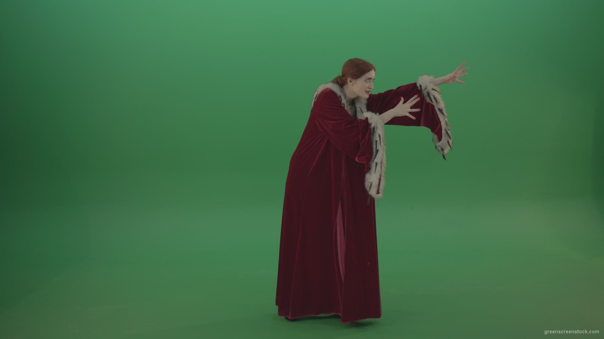 vj video background Red-dress-Witch-shooting-black-magic-energy-on-a-green-background_003