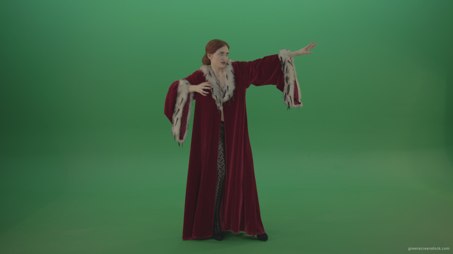 Red-dress-Witch-shooting-black-magic-energy-on-a-green-background_006 Green Screen Stock