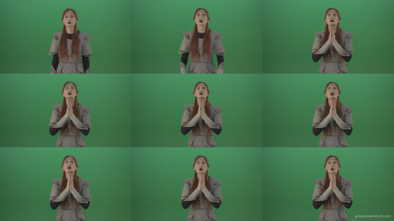 Red-hair-girl-praying-god-in-medieval-warrior-costume-in-green-screen-studio Green Screen Stock