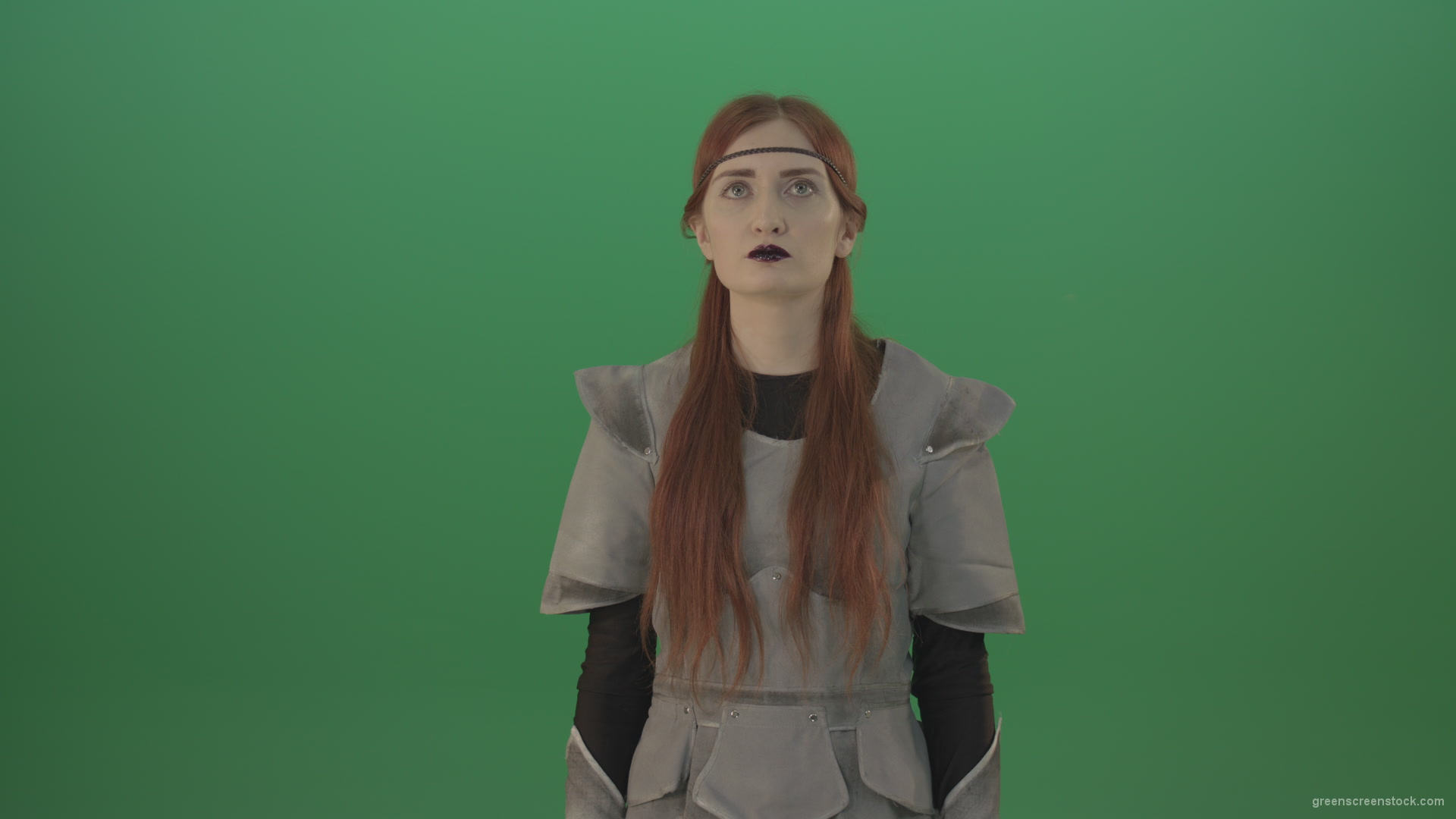 Red-hair-girl-praying-god-in-medieval-warrior-costume-in-green-screen-studio_001 Green Screen Stock