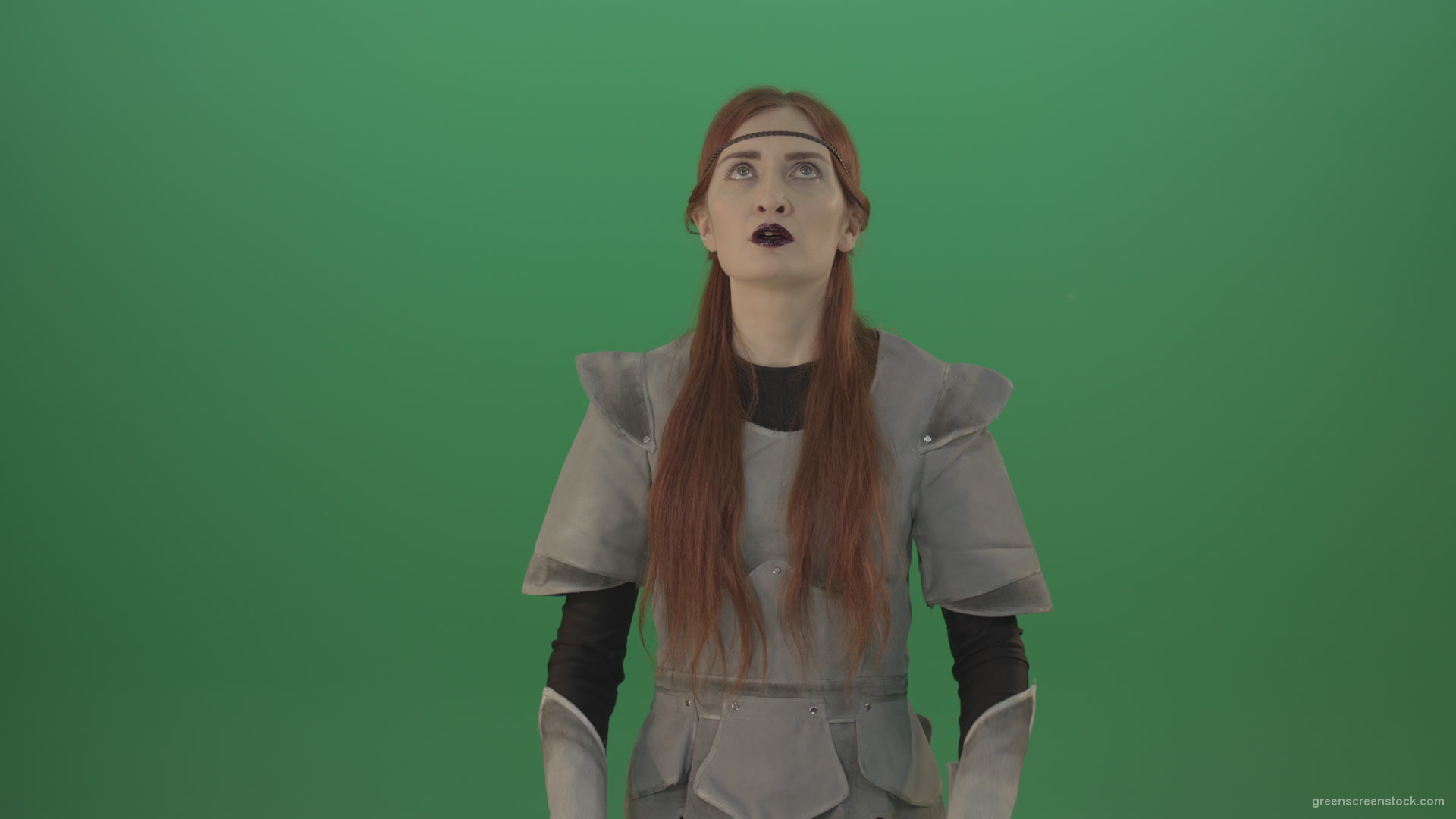 Red-hair-girl-praying-god-in-medieval-warrior-costume-in-green-screen-studio_002 Green Screen Stock