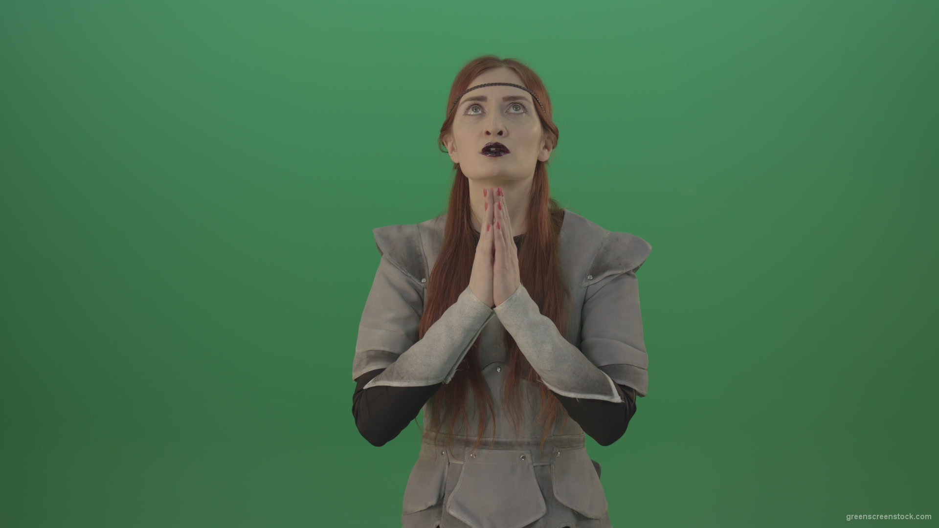 vj video background Red-hair-girl-praying-god-in-medieval-warrior-costume-in-green-screen-studio_003