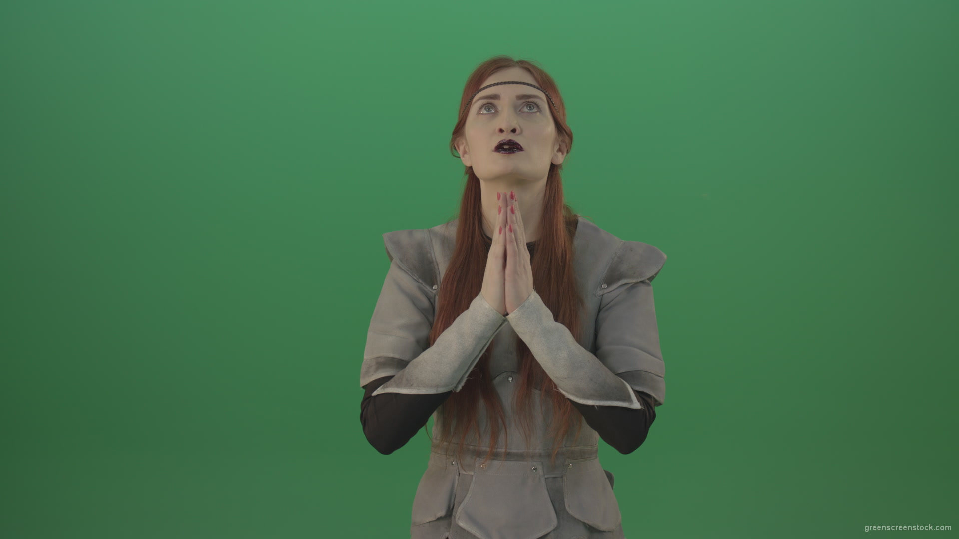 Red-hair-girl-praying-god-in-medieval-warrior-costume-in-green-screen-studio_004 Green Screen Stock