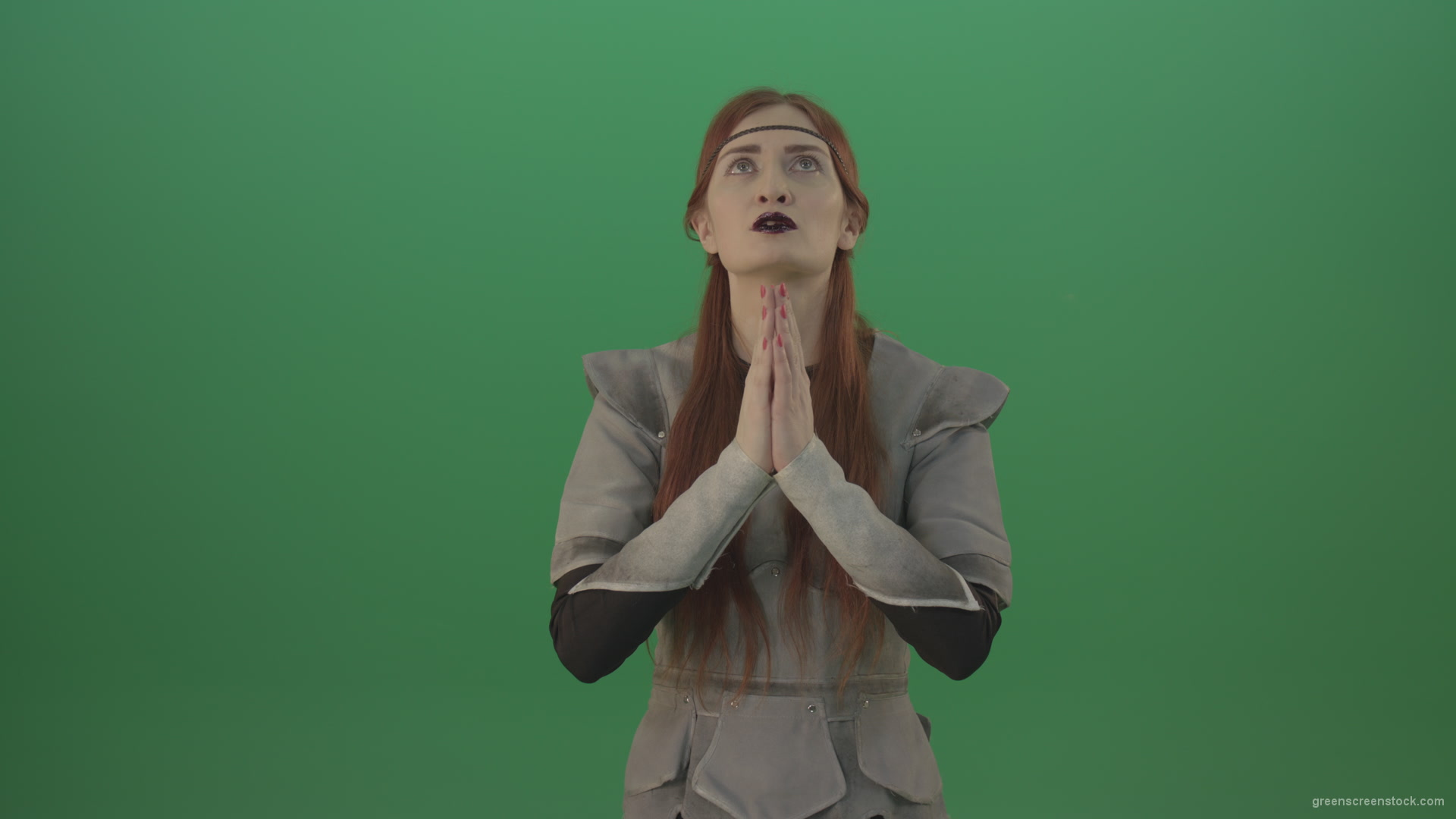 Red-hair-girl-praying-god-in-medieval-warrior-costume-in-green-screen-studio_005 Green Screen Stock